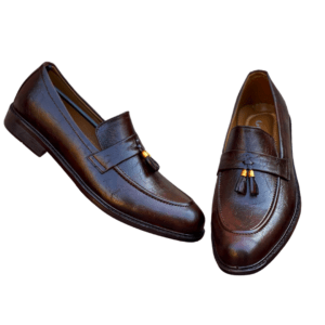 Brown Tussel – Handmade with Imported Synthetic Leather Elevate your style with the Brown Tussel shoes, designed for those who appreciate both elegance and comfort. Made from imported synthetic leather, these shoes showcase a rich brown color and a chic tassel detail that adds a refined touch to your look. The handmade crafted design ensures high-quality construction for long-lasting durability. The TPR sole provides excellent grip and comfort, making these shoes perfect for all-day wear. Whether you're heading to a casual event or out for a day at the office, the Brown Tussel offers superior comfort, stability, and a sophisticated style. The combination of timeless design and practical functionality makes these shoes a must-have in your wardrobe.